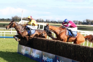 5 April 2021;   Freewheelin Dylan, ridden by Ricky Doyle, leads Run Wild Fred, Jack Kennedy up, over the final obstacle before claiming The BoyleSports Irish Grand National Steeplechase at Fairyhouse.  © Peter Mooney, 59 Upper George's Street, Dun Laoghaire, Co. Dublin, A96 H2R3, Ireland  Tel: 00 353 (0)86 2589298