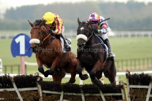 7 April 2019;  DISCORDANTLY, Robbie Power up, right, jumps the last flight with runner-up La Tektor, Denis O'Regan up, gaining victory in The Colm Quinn BMW Maiden Hurdle at Fairyhouse.      © Peter Mooney, 59 Upper George's Street, Dun Laoghaire, Co. Dublin, Ireland.    Tel:  00 353 (0)86 2589298