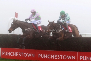 6 December 2020;  Min, Patrick Mullins aboard, takes the final obstacle ahead of stable companion, Tornado Flyer, Bryan Cooper up, before winning The John Durkan Memorial Punchestown Steeplechase at Punchestown. © Peter Mooney, 59 Upper George's Street, Dun Laoghaire, Co. Dublin, A96 H2R3, Ireland  Tel: 00 353 (0)86 2589298