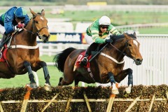 14 March 2000; Istabraq, Charlie Swan up, jumps the final flight before winning The Smurfit Champion Hurdle at Cheltenham.© Peter Mooney, 59 Upper George's Street, Dun Laoghaire, Co. Dublin A96 H2R3, Ireland.  Tel:  00 353 (0)86 2589298